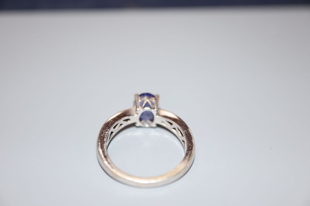 A modern Illana 18ct white gold and oval tanzanite ring, size O.